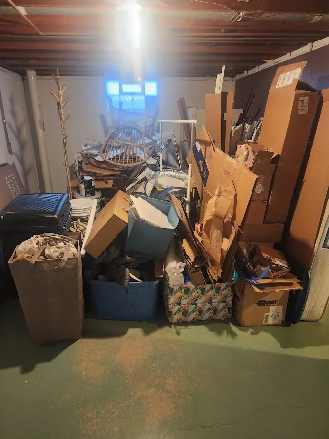 Roll-off dumpster container at job site for 2 Yard Dumpster Rental in Bruce